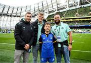 22 October 2022; Mascot Cormac de Búrca with Leinster players, from left, Jordan Larmour, Tommy O'Brien and Jamison Gibson-Park at the United Rugby Championship match between Leinster and Munster at Aviva Stadium in Dublin. Photo by Harry Murphy/Sportsfile