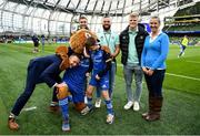 22 October 2022; Mascot Cormac de Búrca and his parents Eamon and Michelle with Leo the Lion and Leinster players, from left, Jordan Larmour, Jamison Gibson-Park and Tommy O'Brien at the United Rugby Championship match between Leinster and Munster at Aviva Stadium in Dublin. Photo by Harry Murphy/Sportsfile