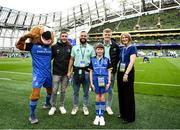 22 October 2022; Mascot Maria McCarthy with her mother Emma, Leo the Lion and Leinster players, from left, Jordan Larmour, Jamison Gibson-Park and Tommy O'Brien at the United Rugby Championship match between Leinster and Munster at Aviva Stadium in Dublin. Photo by Harry Murphy/Sportsfile