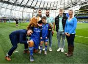 22 October 2022; Mascot Cormac de Búrca and his parents Eamon and Michelle with Leo the Lion and Leinster players, from left, Jordan Larmour, Jamison Gibson-Park and Tommy O'Brien at the United Rugby Championship match between Leinster and Munster at Aviva Stadium in Dublin. Photo by Harry Murphy/Sportsfile