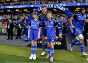 22 October 2022; Leinster captain Jonathan Sexton with matchday mascots Maria McCarthy and Cormac de Búrca at the United Rugby Championship match between Leinster and Munster at Aviva Stadium in Dublin. Photo by Harry Murphy/Sportsfile