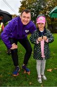 23 October 2022; Vhi ambassador and Olympian David Gillick with Mila Ryan, aged 6, after receiving her green marathon wristband for completing 21 parkruns, before the Deerpark junior parkrun where Vhi welcomed all attendees for a special event led by Vhi ambassador and Olympian David Gillick. Junior parkruns are 2km long and cater for 4 to 14-year olds, free of charge providing a fun and safe environment for children to enjoy exercise. To register for a parkrun near you visit www.parkrun.ie. Photo by Sam Barnes/Sportsfile