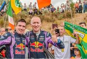 23 October 2022; Craig Breen and Paul Nagle celebrating with Irish Fans at the powerstage finish during day four of the FIA World Rally Championship RACC Catalunya in Spain. Photo by Philip Fitzpatrick/Sportsfile