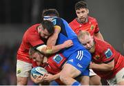 22 October 2022; Scott Buckley of Munster, supported by Diarmuid Barron, left, and Jeremy Loughman, is tackled by Thomas Clarkson of Leinster during the United Rugby Championship match between Leinster and Munster at Aviva Stadium in Dublin. Photo by Ramsey Cardy/Sportsfile