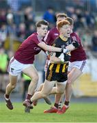 23 October 2022; Diarmuid McGann of Strokestown in action against Luke Glennon, left, and Cathal Feely of Boyle during the Roscommon County Senior Club Football Championship Final match between Boyle and Strokestown at Dr Hyde Park in Roscommon. Photo by Seb Daly/Sportsfile