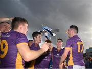 23 October 2022; Kilmacud Crokes players celebrate with the  trophy after their side's victory in the Dublin County Senior Club Hurling Championship Final match between Kilmacud Crokes and Na Fianna at Parnell Park in Dublin. Photo by Harry Murphy/Sportsfile