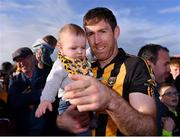 23 October 2022; Gary Brennan of Ballyea with his son Daithí, aged 11 months, after his side's victory in the Clare County Senior Club Hurling Championship Final match between Ballyea and Éire Óg Ennis at Cusack Park in Ennis, Clare. Photo by Piaras Ó Mídheach/Sportsfile