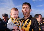 23 October 2022; Gary Brennan of Ballyea with his son Daithí, aged 11 months, after his side's victory in the Clare County Senior Club Hurling Championship Final match between Ballyea and Éire Óg Ennis at Cusack Park in Ennis, Clare. Photo by Piaras Ó Mídheach/Sportsfile