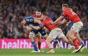 22 October 2022; Jack Conan of Leinster is tackled by James French and Rory Scannell of Munster during the United Rugby Championship match between Leinster and Munster at Aviva Stadium in Dublin. Photo by Brendan Moran/Sportsfile