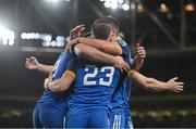 22 October 2022; Leinster players celebrate with team-mate Rob Russell after he scored their side's fourth try during the United Rugby Championship match between Leinster and Munster at Aviva Stadium in Dublin. Photo by Brendan Moran/Sportsfile