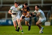 23 October 2022; Stephen Morris of Crossmaglen Rangers in action against Kieran Doyle, left, and Ross Finn of Granemore during the Armagh County Senior Club Football Championship Final match between Crossmaglen Rangers and Granemore at Athletic Grounds in Armagh. Photo by Ramsey Cardy/Sportsfile