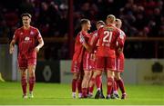 24 October 2022; Kameron Ledwidge of Shelbourne, hidden, celebrates with team-mates after scoring his side's first goal during the SSE Airtricity League Premier Division match between Shelbourne and UCD at Tolka Park in Dublin. Photo by Tyler Miller/Sportsfile