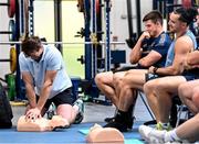 26 October 2022; Leinster Rugby, together with Rugby Players Ireland, hosted a CPR training event at UCD last week. The Irish Heart Foundation was a charity partner of Leinster Rugby last season and through that partnership and with the help of Rugby Players Ireland, the Foundation provided a training session on CPR to the Senior and Academy players in the Leinster Rugby high performance centre in UCD. Pictured are Ryan Baird, left, with Dan Sheehan and James Lowe. For further information please visit www.irishheart.ie. Photo by Harry Murphy/Sportsfile