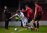 26 October 2022; Edward McCarthy of Galway United is tackled by Dean McMenamy, 20, and Ben Lynch of Longford Town during the SSE Airtricity League First Division play-off semi-final first leg match between Longford Town and Galway United at Bishopsgate in Longford. Photo by Ben McShane/Sportsfile