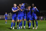 26 October 2022; Phoenix Patterson of Waterford, second from right, celebrates with teammates, from left, Darragh Power, Yassine En-Neyah, Wassim Aouachria and Junior Quitirna after scoring their side's second goal during the SSE Airtricity League First Division play-off semi-final first leg match between Treaty United and Waterford at Markets Field in Limerick. Photo by Seb Daly/Sportsfile