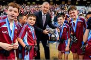 27 October 2022; Colm McGee of St Fiachras SNS is presented with the cup by Dublin GAA CEO John Costello during day one of the Allianz Cumann na mBunscoil Football Finals at Croke Park in Dublin. Photo by Eóin Noonan/Sportsfile