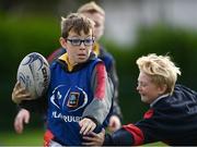 27 October 2022; Tadhg Ward of Scoil Assaim Boys National School, left, during the Leinster Rugby Primary School Tag Blitz at Clontarf RFC in Dublin. Photo by Harry Murphy/Sportsfile