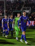 26 October 2022; Waterford captain Killian Cantwell leads his side out before during the SSE Airtricity League First Division play-off semi-final first leg match between Treaty United and Waterford at Markets Field in Limerick. Photo by Seb Daly/Sportsfile