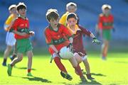 28 October 2022; Ryan Kearon of St Patricks NS in action against Evan O'Brien of Sacred Heart NS during day two of the Allianz Cumann na mBunscoil Football Finals at Croke Park in Dublin. Photo by Eóin Noonan/Sportsfile