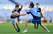 28 October 2022; Ryan Biddulph of Rolestown NS in action against Ollie O'Callaghan of Donabate Portrane during day two of the Allianz Cumann na mBunscoil Football Finals at Croke Park in Dublin. Photo by Eóin Noonan/Sportsfile