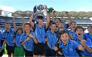 28 October 2022; Donabate Portrane captain Kevin O'Leary lifts the cup after victory over Rolestown NS during day two of the Allianz Cumann na mBunscoil Football Finals at Croke Park in Dublin. Photo by Eóin Noonan/Sportsfile