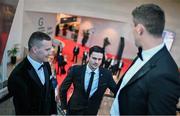 28 October 2022; Chrissy McKaigue of Derry, centre, and Ciarán Kilkenny of Dublin, left, arrive for the PwC All-Stars Awards 2022 show at the Convention Centre in Dublin. Photo by Ramsey Cardy/Sportsfile