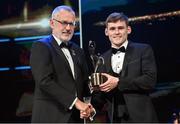 28 October 2022; Gavin White of Kerry is presented with his PwC All-Star award by Uachtarán Chumann Lúthchleas Gael Larry McCarthy during the PwC All-Stars Awards 2022 show at the Convention Centre in Dublin. Photo by Ramsey Cardy/Sportsfile
