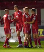 28 October 2022; Sean Boyd of Shelbourne, second from left, celebrates with team-mate Jonathan Lunney after scoring his side's third goal during the SSE Airtricity League Premier Division match between Shelbourne and Drogheda United at Tolka Park in Dublin. Photo by Tyler Miller/Sportsfile