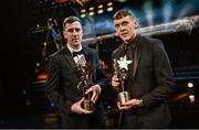 28 October 2022; Hurler of the year Diarmaid Byrnes of Limerick, left, and Footballer of the year David Clifford of Kerry, with their PwC All Star Player of the Year awards at the PwC All-Stars Awards 2022 at the Convention Centre in Dublin. Photo by Ramsey Cardy/Sportsfile