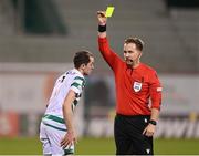 27 October 2022; Referee Julian Weinberger shows a yellow card to Sean Kavanagh of Shamrock Rovers during the UEFA Europa Conference League group F match between Shamrock Rovers and Gent at Tallaght Stadium in Dublin. Photo by Seb Daly/Sportsfile
