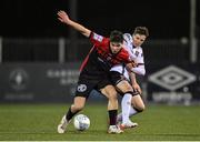 28 October 2022; James Clarke of Bohemians in action against Alfie Lewis of Dundalk during the SSE Airtricity League Premier Division match between Dundalk and Bohemians at Casey's Field in Dundalk, Louth. Photo by Seb Daly/Sportsfile