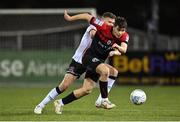 28 October 2022; James Clarke of Bohemians in action against Andy Boyle of Dundalk during the SSE Airtricity League Premier Division match between Dundalk and Bohemians at Casey's Field in Dundalk, Louth. Photo by Seb Daly/Sportsfile