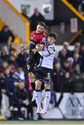28 October 2022; Liam Burt of Bohemians in action against Alfie Lewis of Dundalk during the SSE Airtricity League Premier Division match between Dundalk and Bohemians at Casey's Field in Dundalk, Louth. Photo by Seb Daly/Sportsfile