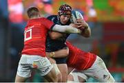 29 October 2022; Luke Marshall of Ulster is tackled by Jack Crowley, left, and John Hodnett of Munster during the United Rugby Championship match between Munster and Ulster at Thomond Park in Limerick. Photo by Brendan Moran/Sportsfile