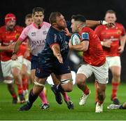 29 October 2022; Paddy Patterson of Munster is tackled by Duane Vermeulen of Ulster during the United Rugby Championship match between Munster and Ulster at Thomond Park in Limerick. Photo by Brendan Moran/Sportsfile