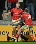 29 October 2022; Shane Daly of Munster, left, celebrates with team-mate Mike Haley  after scoring their side's first  try during the United Rugby Championship match between Munster and Ulster at Thomond Park in Limerick. Photo by Brendan Moran/Sportsfile