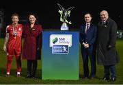 29 October 2022; Shelbourne captain Pearl Slattery is presented with the cup by from left, SSE Airtricity marketing executive Ruth Rapple, League of Ireland director Mark Scanlon and FAI President Gerry McAnaney during the SSE Airtricity Women's National League match between Wexford Youths and Shelbourne at Ferrycarrig Park in Wexford. Photo by Eóin Noonan/Sportsfile