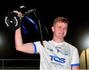 29 October 2022; Waterford captain Calum Lyons lifts the trophy after his side's victory in the match between TG4 Underdogs and Waterford at the SETU Arena in Waterford. Photo by Seb Daly/Sportsfile
