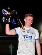 29 October 2022; Waterford captain Calum Lyons lifts the trophy after his side's victory in the match between TG4 Underdogs and Waterford at the SETU Arena in Waterford. Photo by Seb Daly/Sportsfile