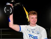 29 October 2022; Waterford captain Calum Lyons lifts the trophy after his side's victory in the match between TG4 Underdogs and Waterford at the SETU Arena in Waterford. Photo by Seb Daly/Sportsfile