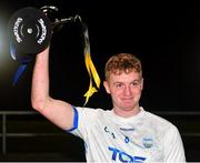 29 October 2022; Waterford captain Calum Lyons lifts the trophy after his side's victory in the match between TG4 Underdogs and Waterford at the SETU Arena in Waterford. Photo by Seb Daly/Sportsfile