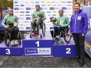 30 October 2022; 2022 Irish Life chief exectuive officer, Declan Bolger presents gold medallist Patrick Monahan, from Kildare, silver medallist Sam Kolek, from Dublin, and bronze medallist Mark Millar from Derry with their medals respectively as the top three wheelchair finishers of the Dublin Marathon. 25,000 runners took to the Fitzwilliam Square start line to participate in the 41st running of the Dublin Marathon after a two-year absence. Photo by Harry Murphy/Sportsfile