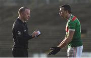30 October 2022; Evan Regan of Ballina Stephenites receives a black card from referee Paul Lydon during the Mayo County Senior Football Championship Final match between Ballina Stephenites and Westport at Hastings Insurance MacHale Park in Castlebar, Mayo. Photo by Conor McKeown/Sportsfile