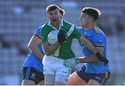 30 October 2022; Tom Clarke of Moycullen in action against Mikey Culhane of Salthill Knocknacarra during the Galway County Senior Club Football Championship Final match between Salthill Knocknacarra and Moycullen at Pearse Stadium in Galway. Photo by Ray Ryan/Sportsfile