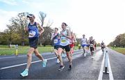30 October 2022; Participants from left, Shane Duffy, from Dunshaughlin AC, Anthony Sharkey, from LSA AC, and Kate Purcell, from Raheny Shamrock AC, compete in the 2022 Irish Life Dublin Marathon. 25,000 runners took to the Fitzwilliam Square start line to participate in the 41st running of the Dublin Marathon after a two-year absence. Photo by David Fitzgerald/Sportsfile