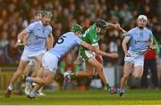 30 October 2022; David Woulfe of Kilmallock is tackled by Mike Foley of Na Piarsaigh during the Limerick County Senior Club Hurling Championship Final match between Kilmallock and Na Piarsaigh at the TUS Gaelic Grounds in Limerick. Photo by Ben McShane/Sportsfile
