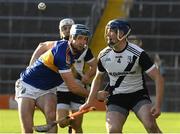 30 October 2022; Kieran Cahill of Kilruane MacDonaghs in action against Joe Gallagher of Kiladangan during the Tipperary County Senior Club Hurling Championship Final Replay match between Kilruane MacDonaghs and Kiladangan at Semple Stadium in Thurles, Tipperary. Photo by Philip Fitzpatrick/Sportsfile