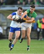 30 October 2022; Darragh Canavan of Errigal Ciarán in action against James Donaghy of Carrickmore during the Tyrone County Senior Club Football Championship Final match between Errigal Ciarán and Carrickmore at O'Neills Healy Park in Omagh, Tyrone.  Photo by Oliver McVeigh/Sportsfile