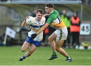 30 October 2022; Darragh Canavan of Errigal Ciarán in action against James Donaghy of Carrickmore during the Tyrone County Senior Club Football Championship Final match between Errigal Ciarán and Carrickmore at O'Neills Healy Park in Omagh, Tyrone.  Photo by Oliver McVeigh/Sportsfile