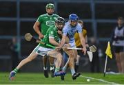 30 October 2022; Keith Dempsey of Na Piarsaigh is tackled by Graeme Mulachy of Kilmallock during the Limerick County Senior Club Hurling Championship Final match between Kilmallock and Na Piarsaigh at the TUS Gaelic Grounds in Limerick. Photo by Ben McShane/Sportsfile
